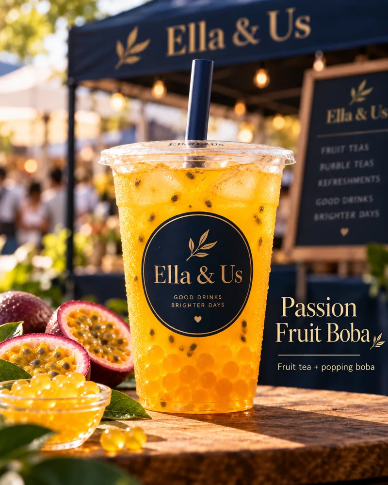 Passion Fruit boba fruit tea in an Ella and Us branded cup