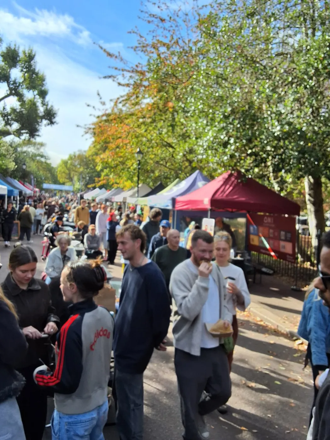 Visitors enjoying a busy Victoria Park Market walkway