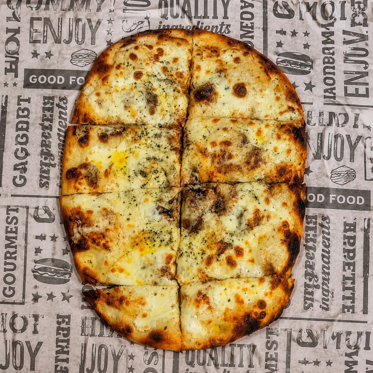 Finished Bianca pinsa cut into eight slices as a serving suggestion